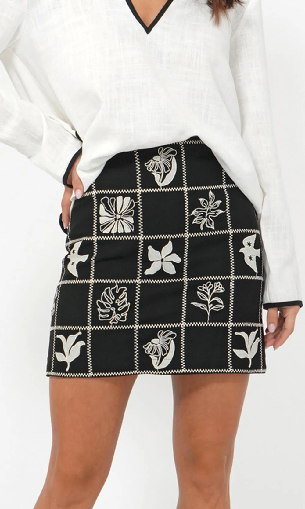 Freya Grid Embroidered Mini Skirt sold by Greylin