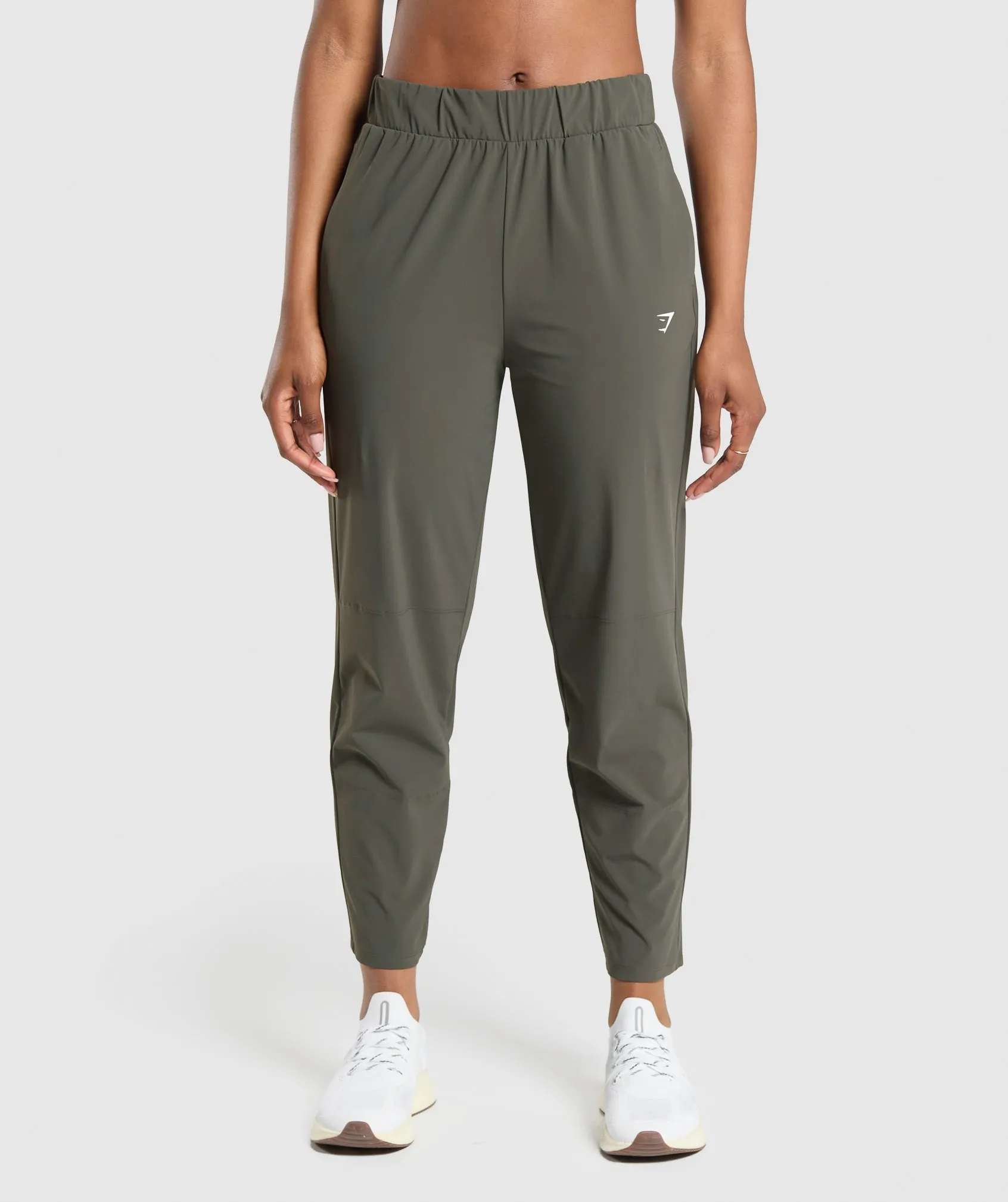 Gymshark Tapered Woven Pants - Strength Green sold by Gymshark