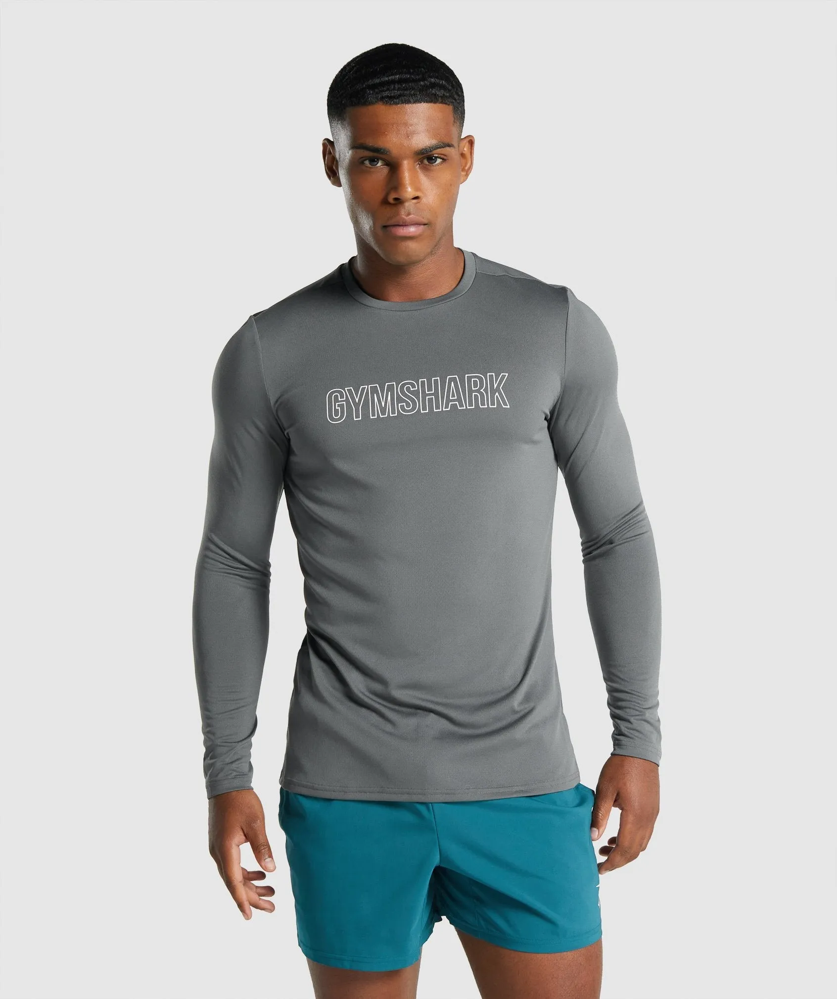 Gymshark Arrival Long Sleeve Graphic T-Shirt - Charcoal sold by Gymshark