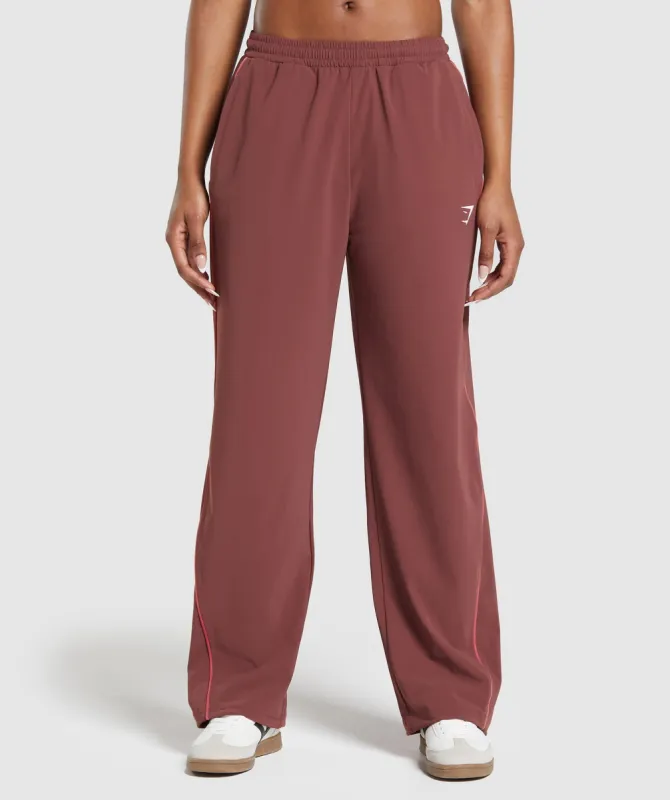 Gymshark Stitch Feature Woven Pants - Burgundy Brown sold by Gymshark