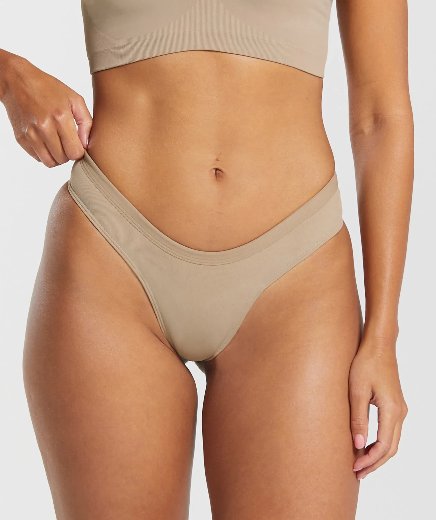 Gymshark Seamless Dipped Front Thong - Cement Brown sold by Gymshark