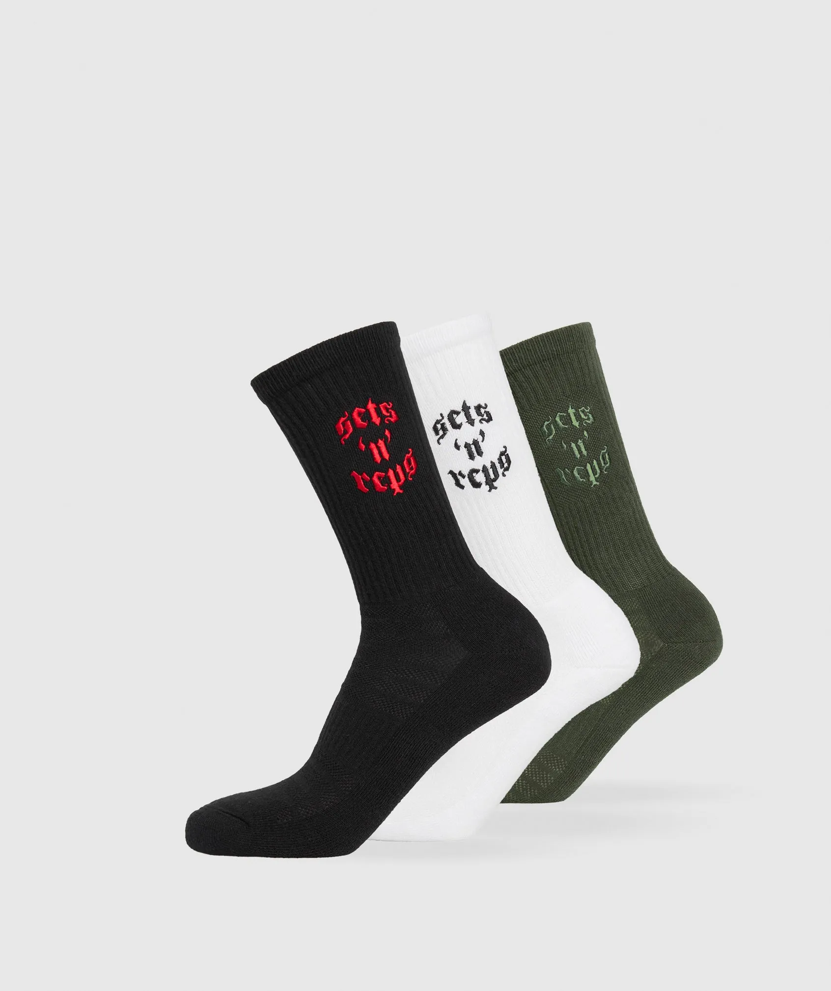 Gymshark Sets and Reps 3pk Crew Socks - White/Winter Olive/Black sold by Gymshark