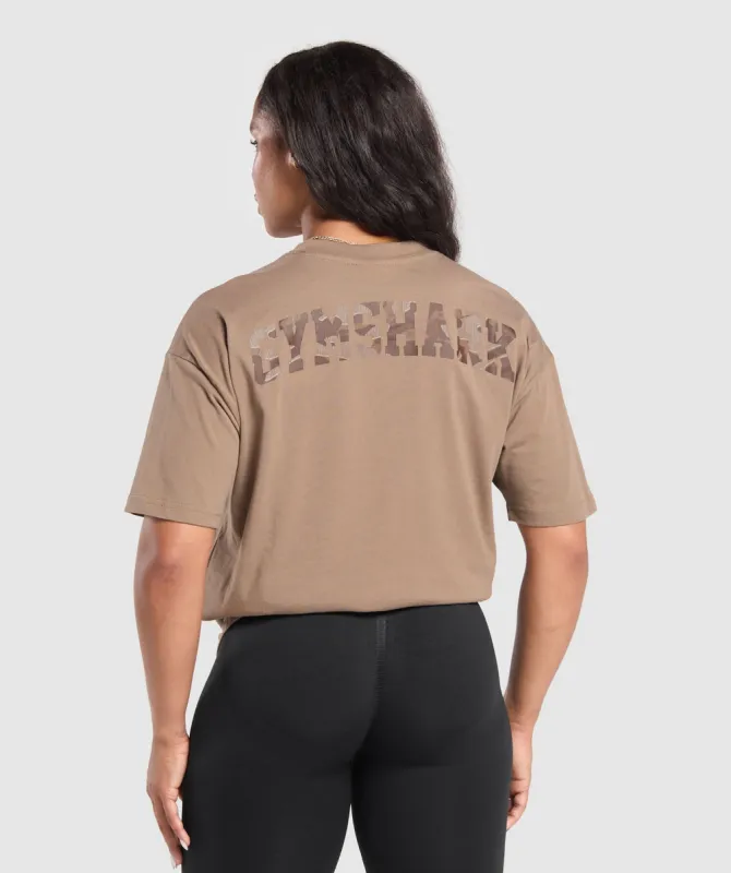 Gymshark Adapt Camo Graphic Oversized Top - Soul Brown sold by Gymshark