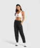 Gymshark Tapered Woven Pants - Black sold by Gymshark