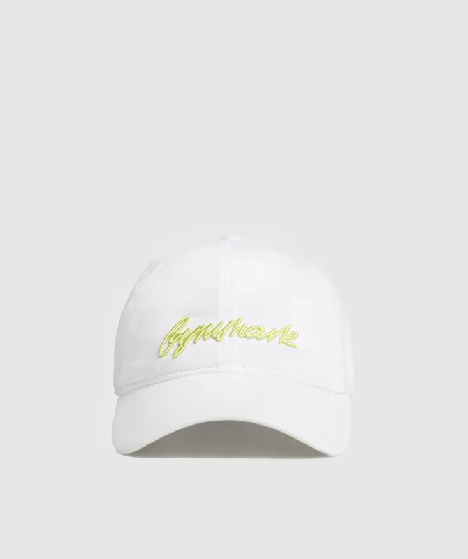 Gymshark Handwriting Baseball Cap - White/Firefly Green sold by Gymshark