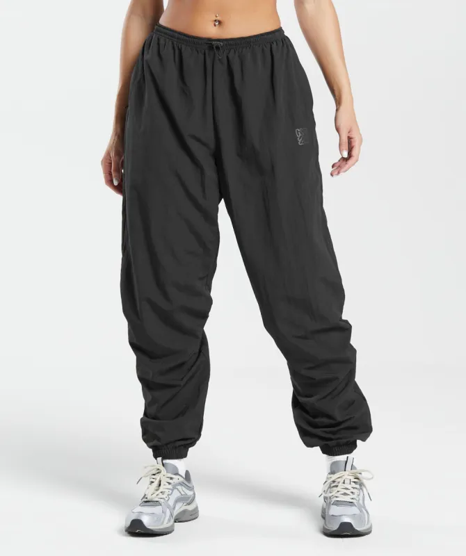 Gymshark Monogram Woven Joggers - Black sold by Gymshark
