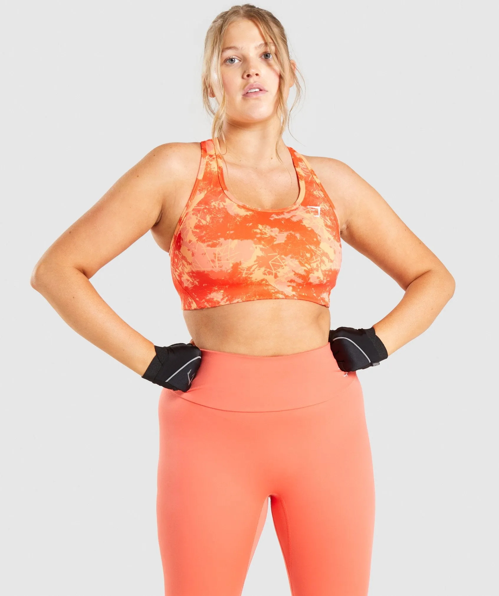 Gymshark Essential Racer Back Sports Bra - Orange Camo Print sold by Gymshark