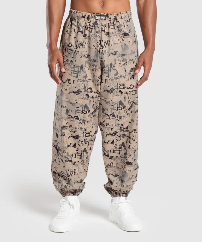 Gymshark Lifting Oversized Printed Woven Pants - Cement Brown sold by Gymshark