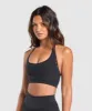 Gymshark Warp Knit Seamless Halerneck Bralette - Black/Linen Brown sold by Gymshark