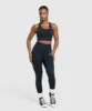 Gymshark Lift Seamless Midi Tank With Shelf - Midnight Blue/Black Marl sold by Gymshark