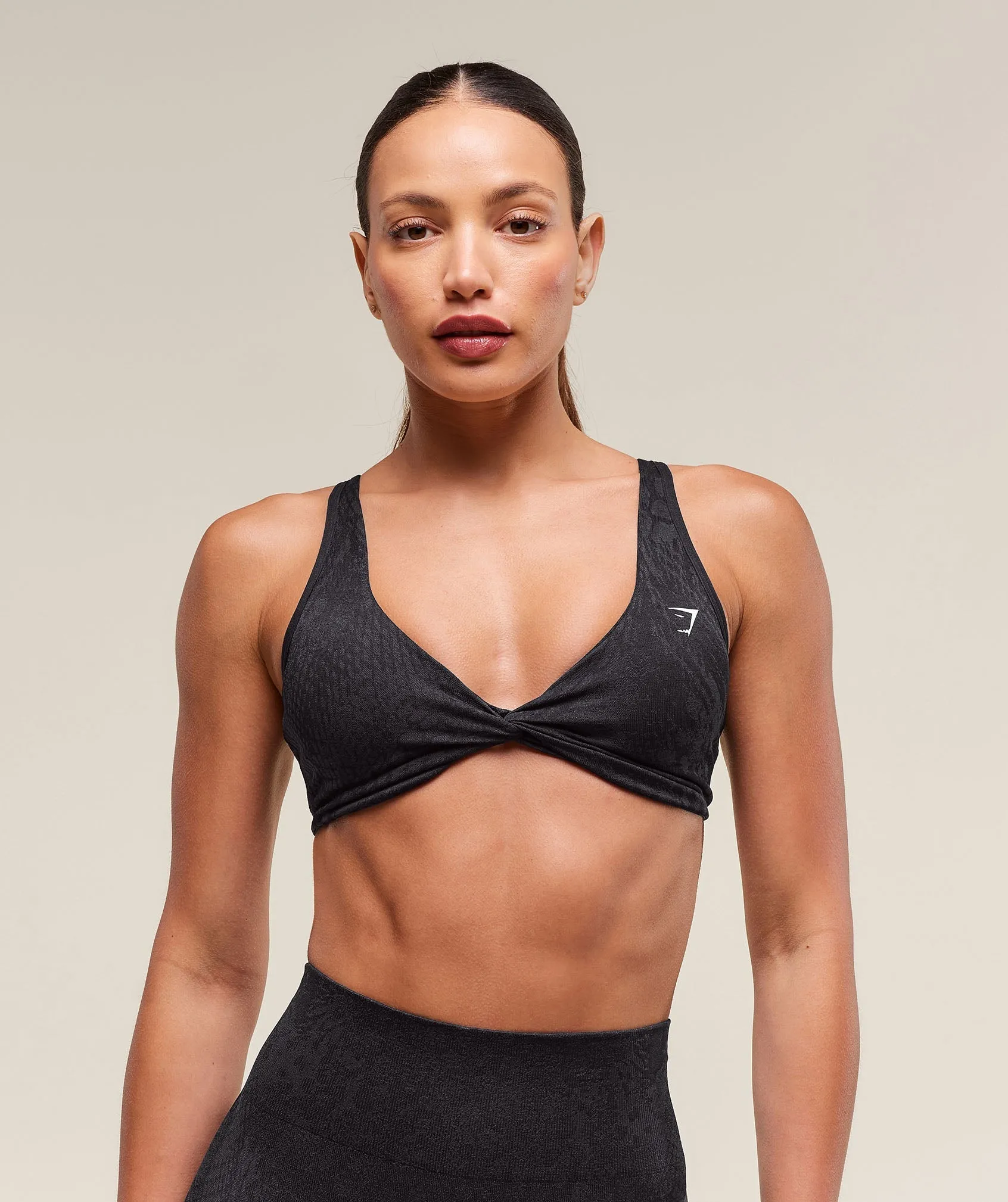 Gymshark Adapt Animal X Whitney Seamless Twist Front Bra - Asphalt Grey/Black sold by Gymshark