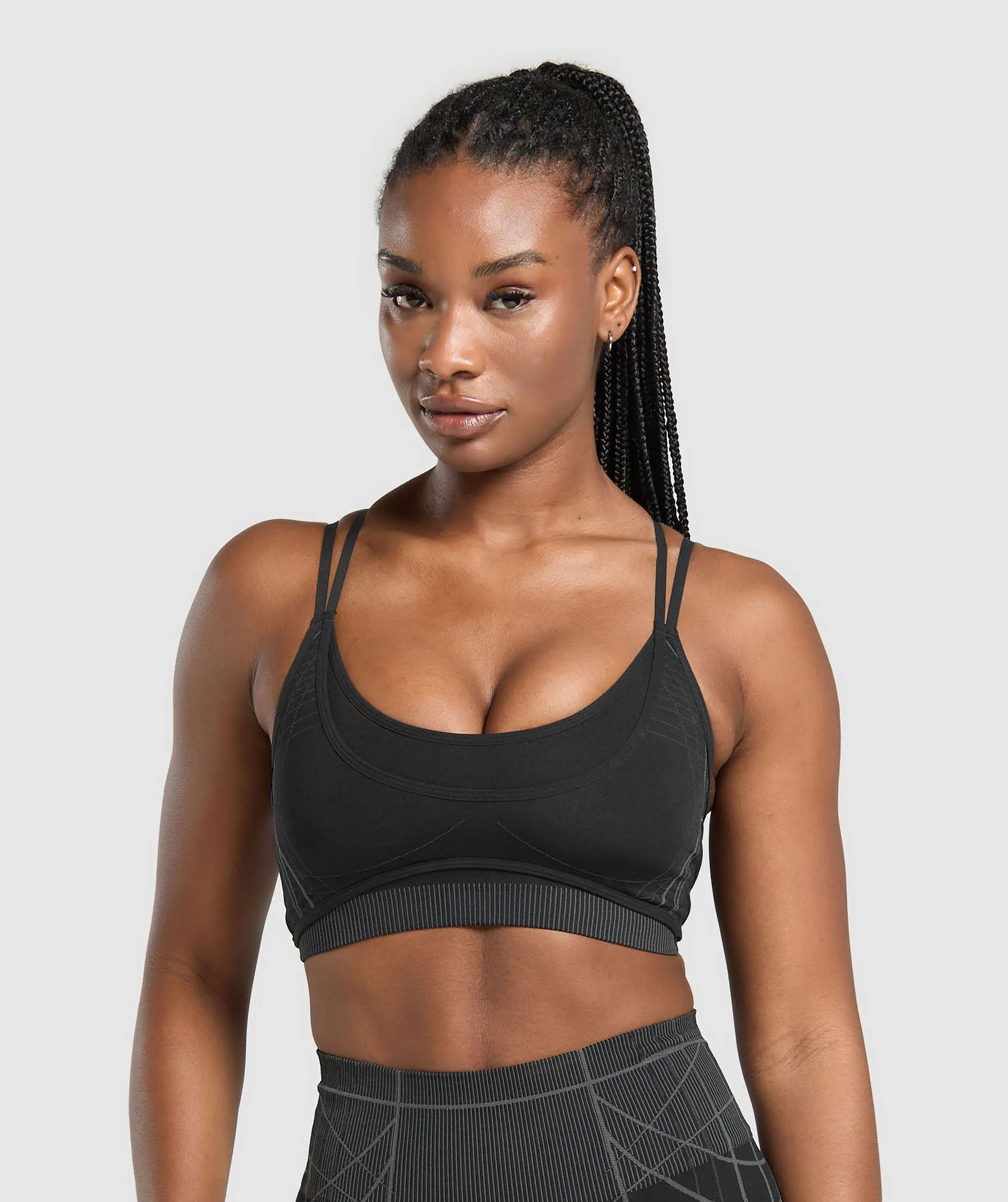 Gymshark Apex Seamless Strappy Sports Bra - Black/Graphite Grey sold by Gymshark