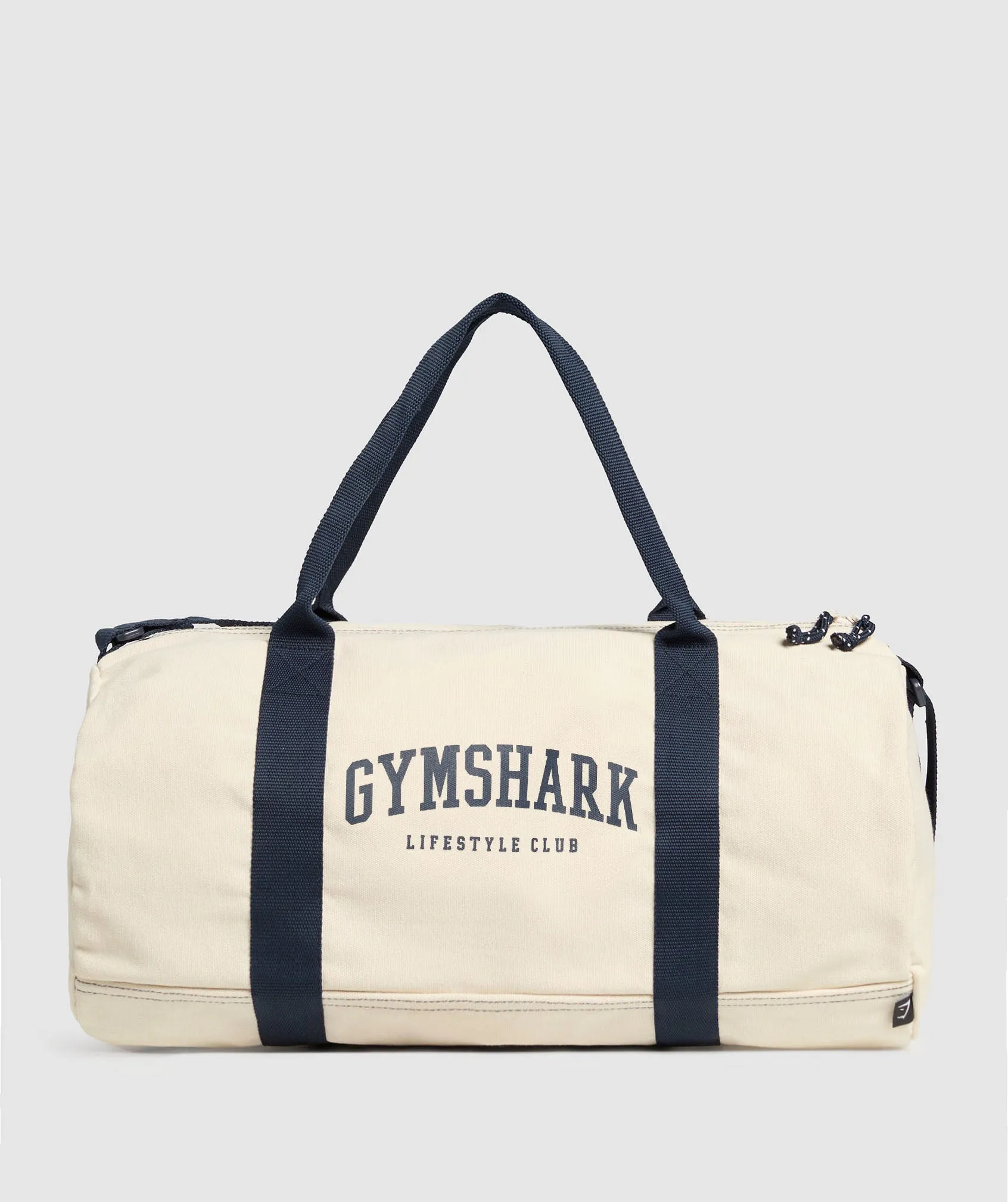 Gymshark Collegiate Canvas Duffle - Oat White/Heavy Blue sold by Gymshark