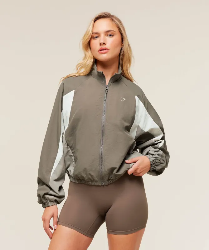 Gymshark Contrast Woven Jacket - Camo Brown/Linen Brown/Oat White sold by Gymshark