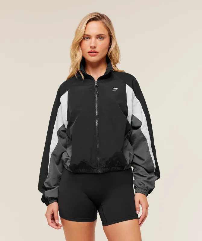 Gymshark Contrast Woven Jacket - Black/Graphite Grey/Oat White sold by Gymshark