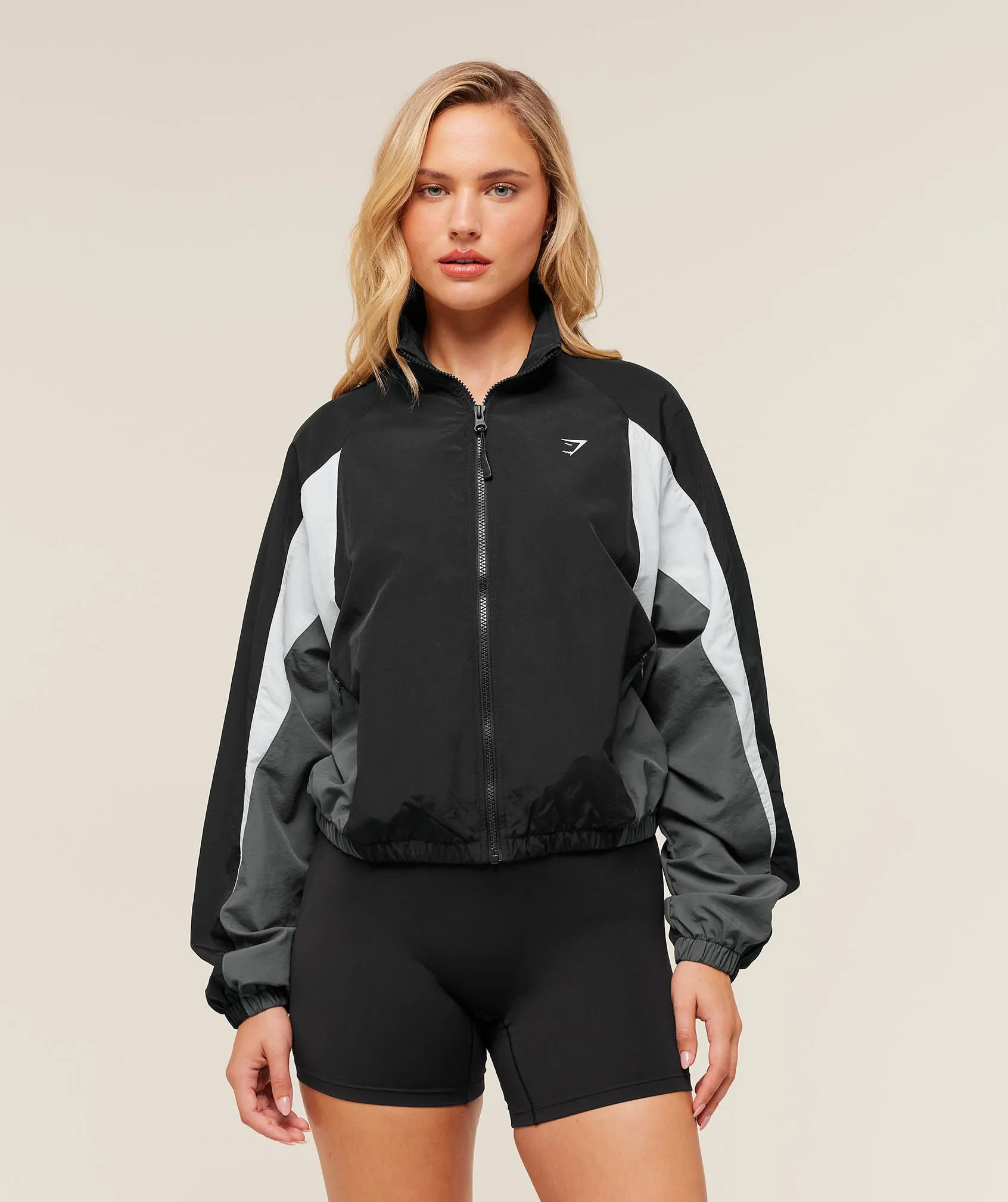 Gymshark Contrast Woven Jacket - Black/Graphite Grey/Oat White sold by Gymshark