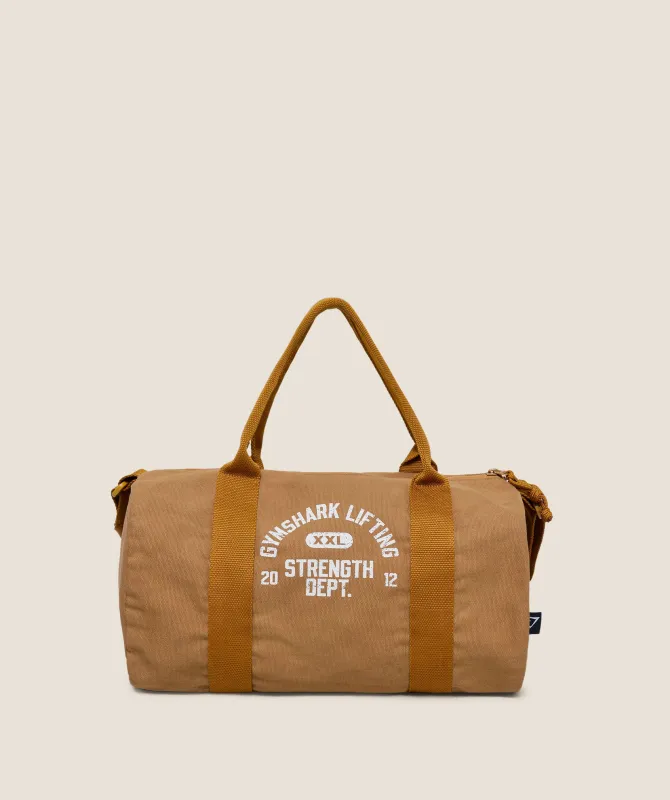 Gymshark Strength Dept Mini Canvas Duffle Bag - Antique Gold sold by Gymshark