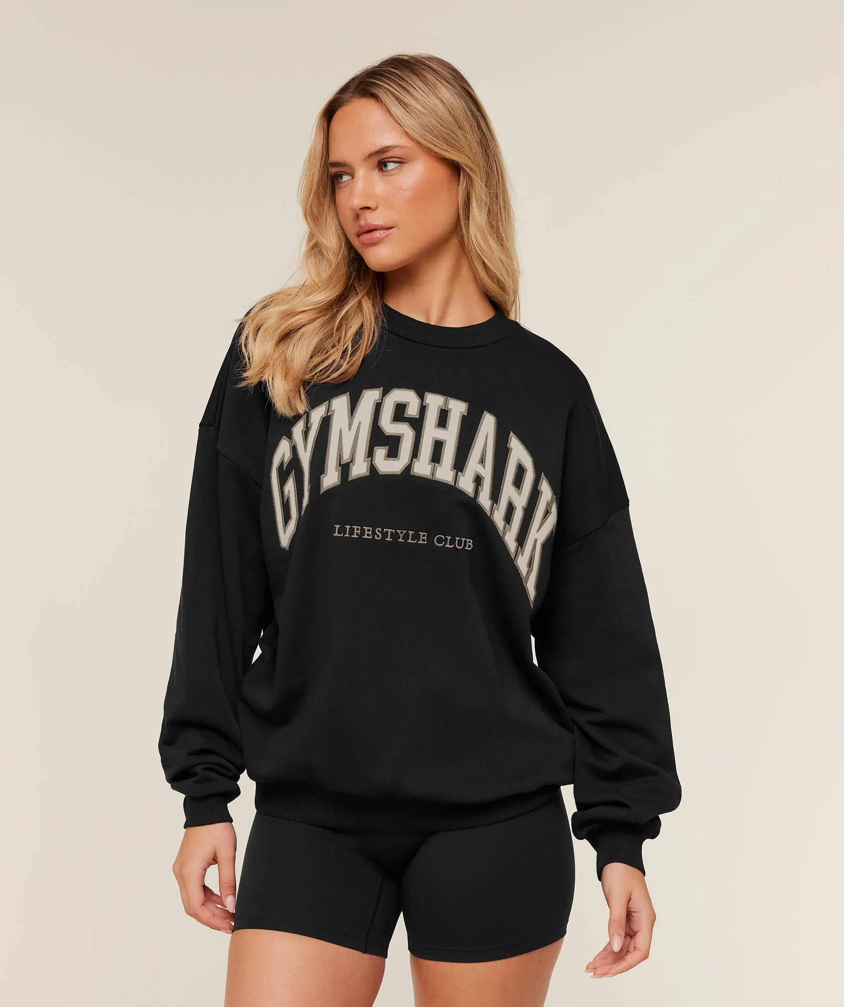 Gymshark Collegiate Graphic Crew Neck Pullover - Black/ Pebble Grey sold by Gymshark