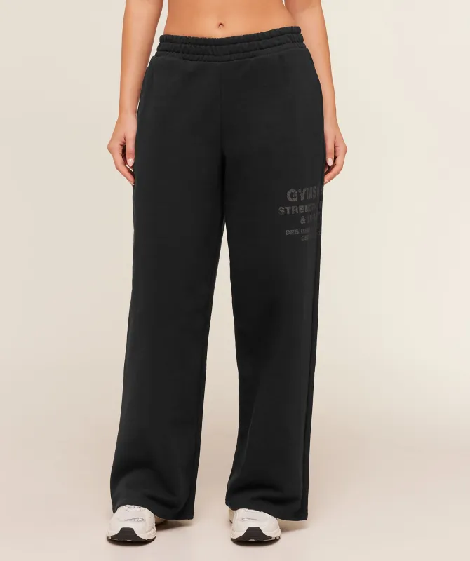 Gymshark Stacked Graphic Wide Leg Joggers - Black made by Gymshark