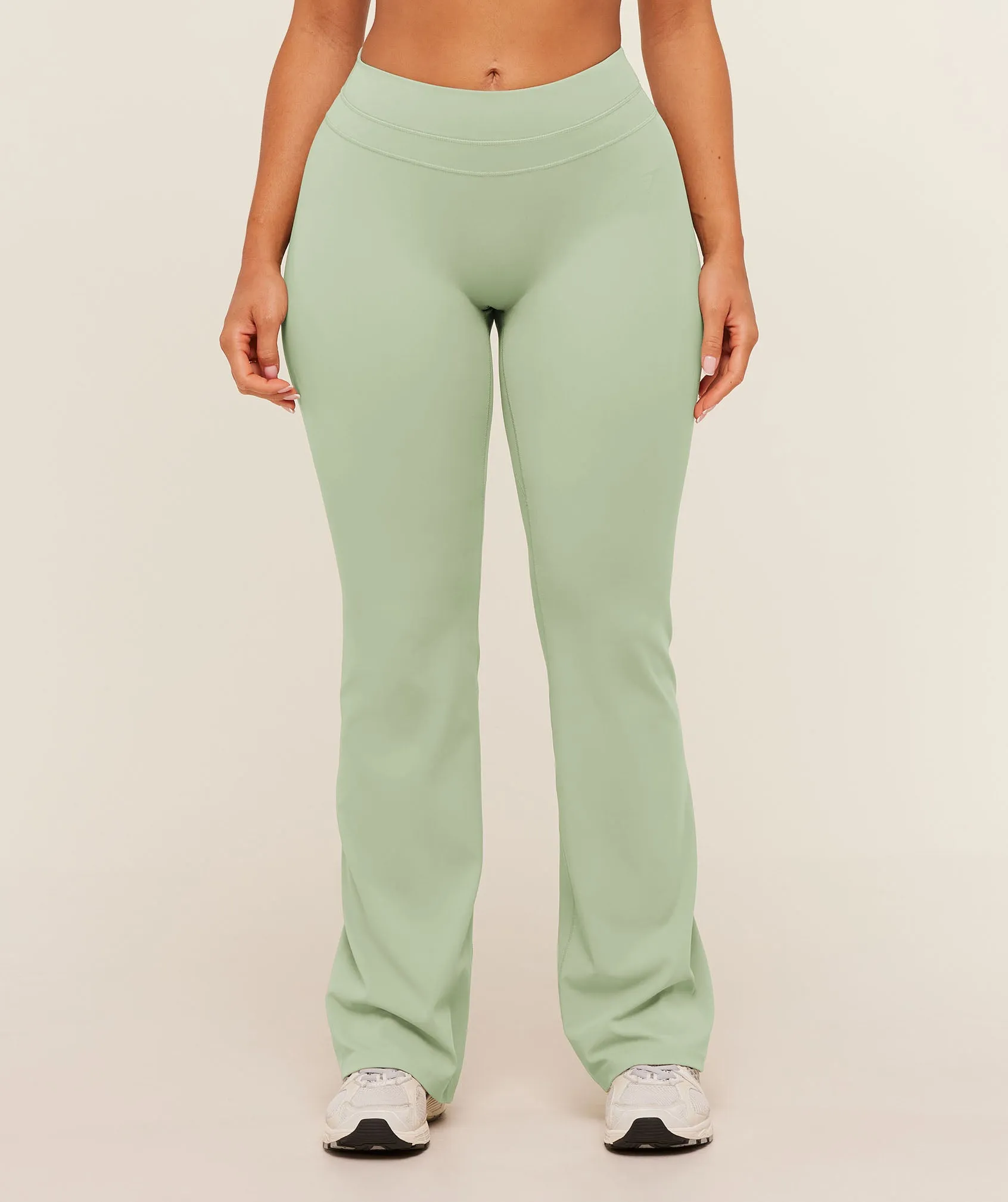 Gymshark Whitney Mid-High Rise Flared Leggings - Haze Green sold by Gymshark