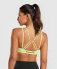 Gymshark Strappy Back Light Support Sports Bra - Pastel Sage Green sold by Gymshark