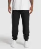 Gymshark Ease Woven Joggers - Black sold by Gymshark