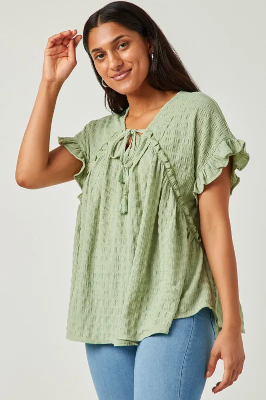 Womens Textured Knit Ruffle Seamed Tassel Tie Top sold by Hayden