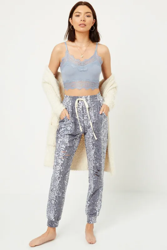 Womens Distressed Snakeskin Joggers sold by Hayden