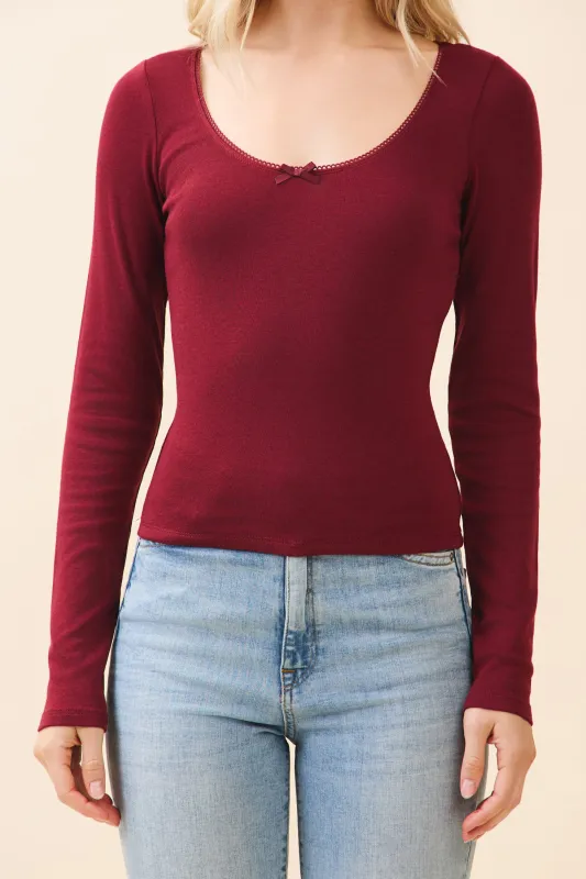 SCOOP NECK W/SATIN BOW AT FRTONT LONG SLEEVE TOP sold by Heart & Hips