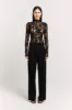 Eira Lace Bodysuit sold by Henne