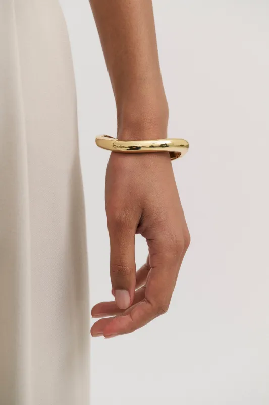 Thin warped Bangle sold by Henne