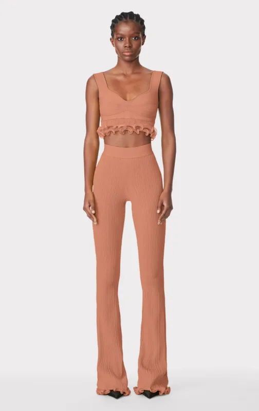 RIBBED PANTS W/ RUFFLED HEM sold by Herve Leger