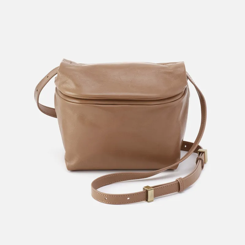 Logan Crossbody In Polished Leather - Cashmere sold by HOBO
