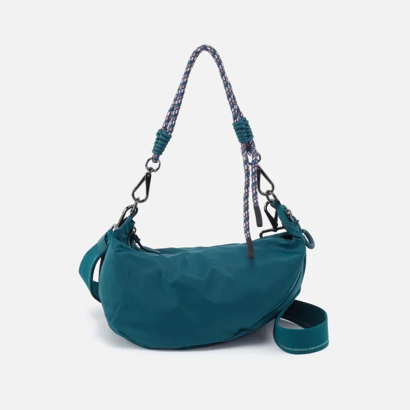 GO FOR IT Sling Crossbody in CaRefiber recycled nylon - Teal sold by HOBO
