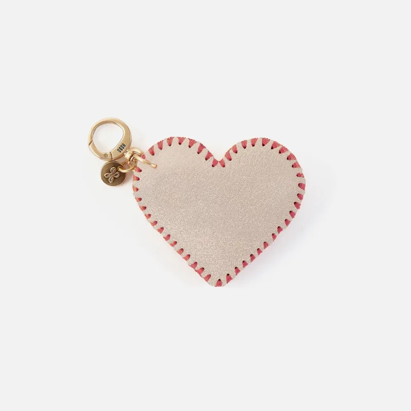 Heart Swells Fob in Metallic Leather - Sand Shimmer sold by HOBO