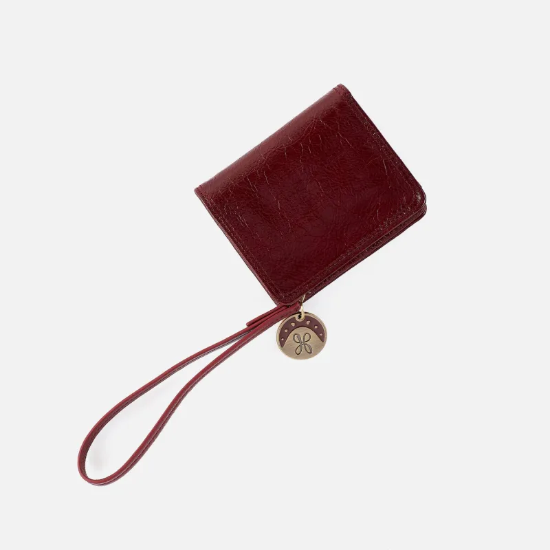 Coin Wristlet Wallet in Gloss Leather - Garnet Gloss sold by HOBO