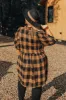 Never Pretend Plaid Dress In Camel Curves sold by Impressions
