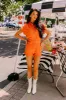 Sweet Duet Distressed Denim Romper in Orange sold by Impressions