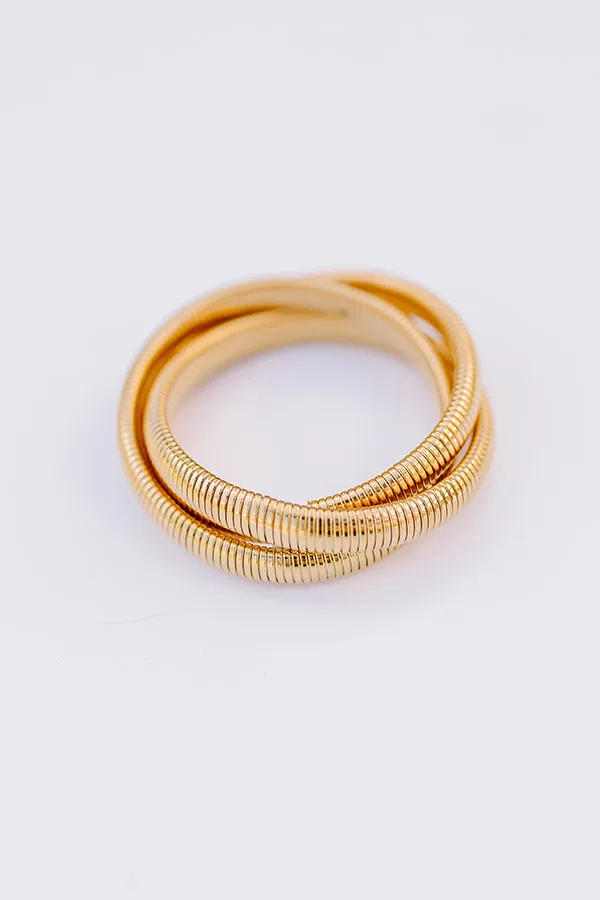 Gold Twisted Cobra Bangle Bracelets sold by Impressions
