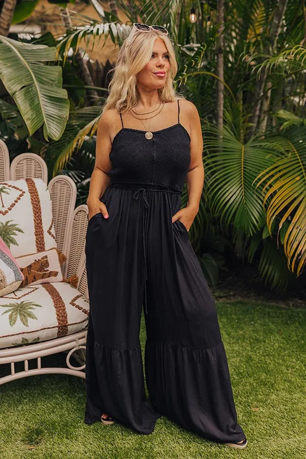 Desirable Destination Smocked Jumpsuit In Black Curves sold by Impressions
