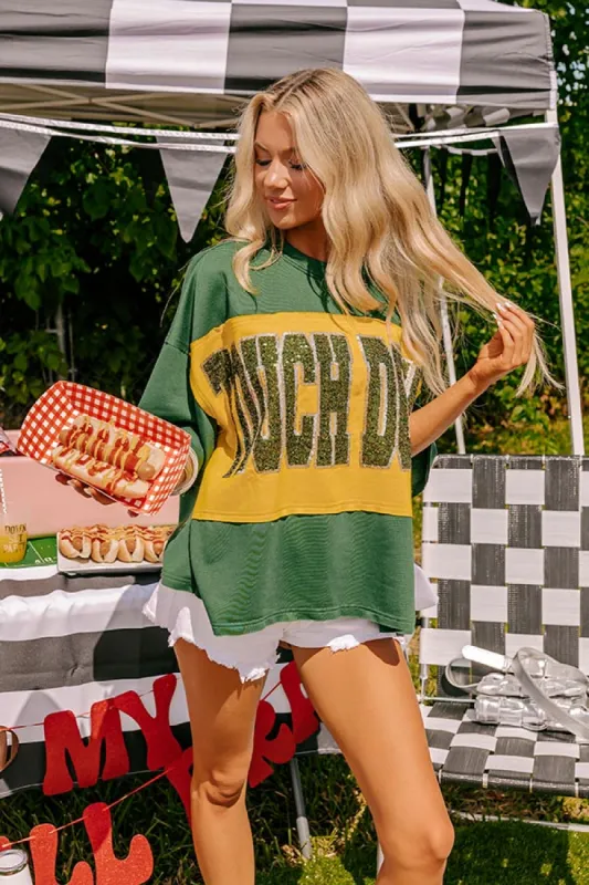 It's a Touch Down Sequin Oversized Tee in Green sold by Impressions
