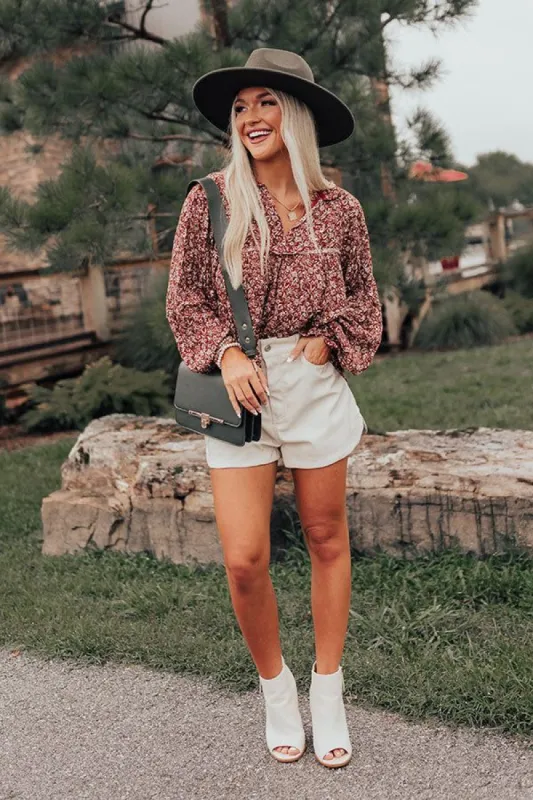 The Ivee Floral Babydoll Top in Rust sold by Impressions