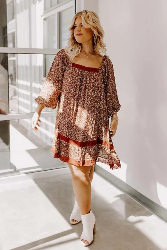 The Amie Floral Shift Dress in Rust Curves sold by Impressions