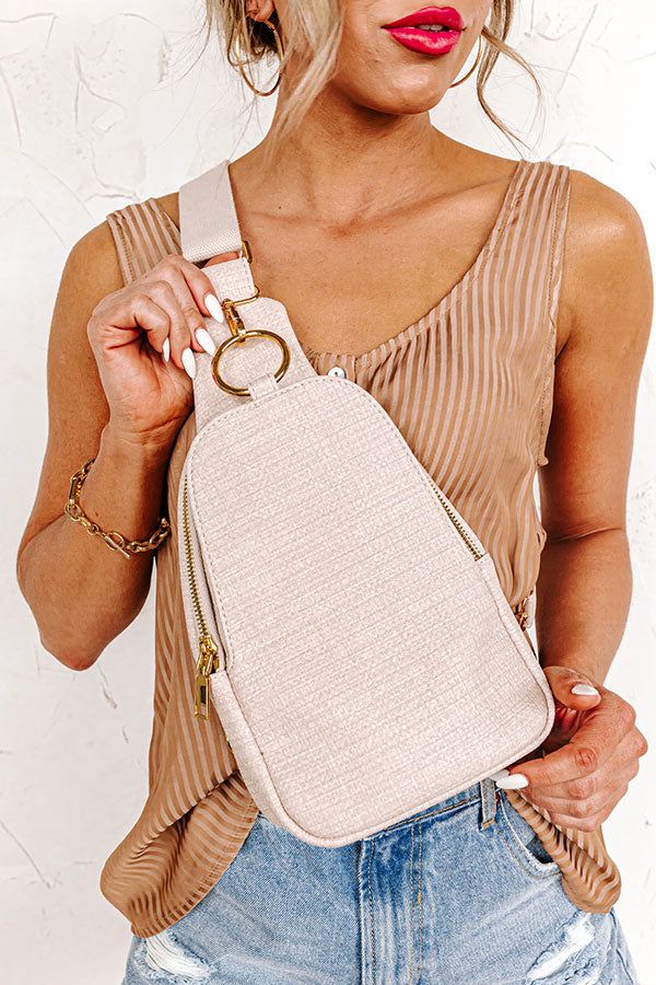 The Brylee Faux Leather Sling Backpack In Natural sold by Impressions