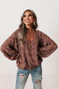 The Winette Floral Top in Rust sold by Impressions