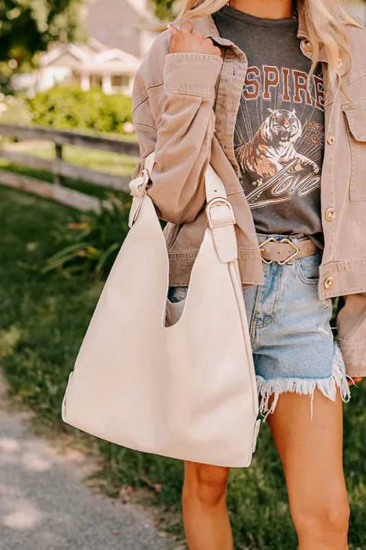 Girl On The Go Faux Leather Tote in Cream sold by Impressions