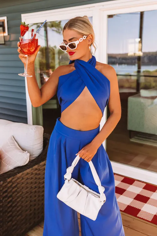 Nearly Famous Wrap Top In Royal Blue sold by Impressions