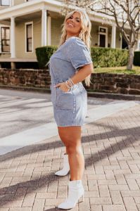 Manhattan Marvels Denim Romper in Medium Wash Curves sold by Impressions