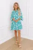 Coastal Cruise Floral Mini Dress in Green sold by Impressions