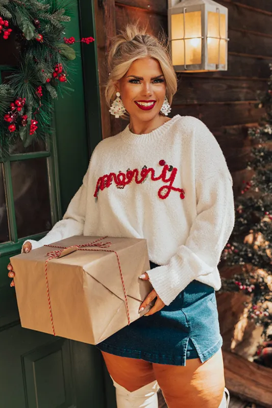 Merry Sequin Sweater Curves sold by Impressions